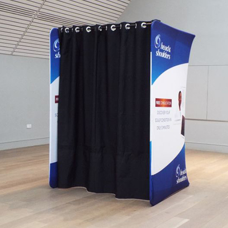 Branded pop-up changing booth advertising Head and Shoulders products