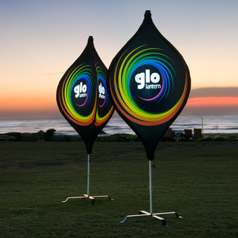 Two large branded lantern pop-out banner with an orange sunset in the background