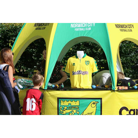 Branded pop-up kiosk advertising Norwich City Merchandise