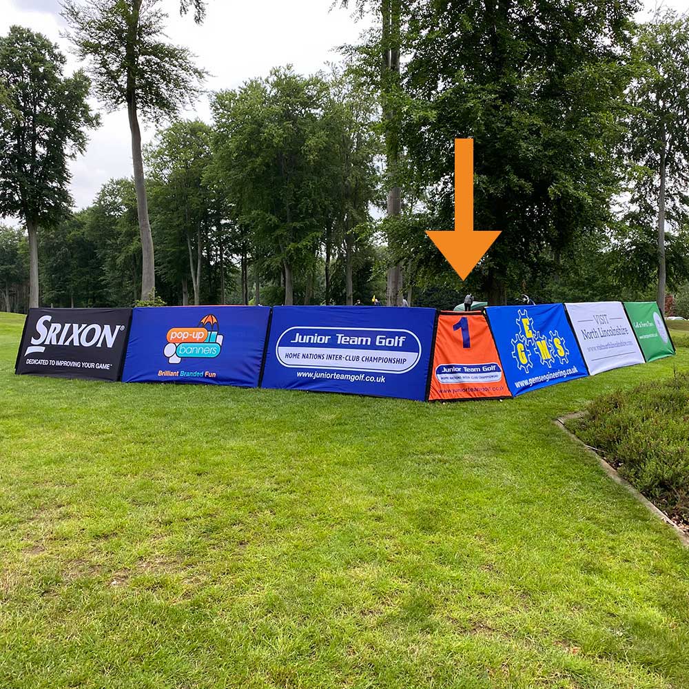 Branded rectangular corner banner units outside on the grass